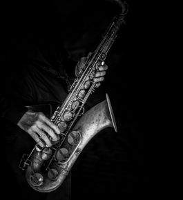 Man playing saxophone integrated marketing section service