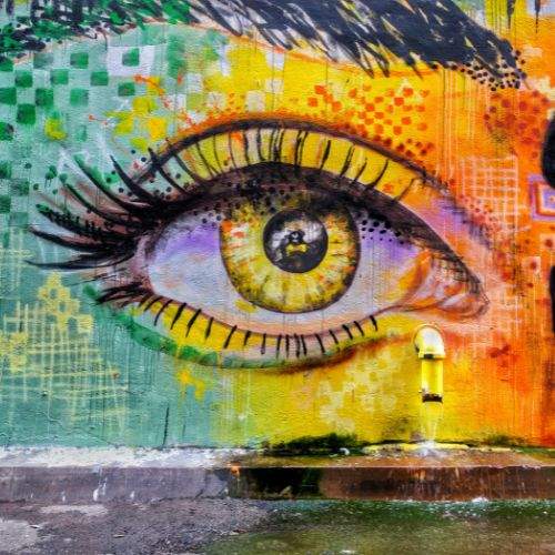 Multicolored graffiti of the eye of a young women
